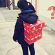 Illustration for article titled Korean Schoolgirls Wearing Backpacks Made of Junk Food